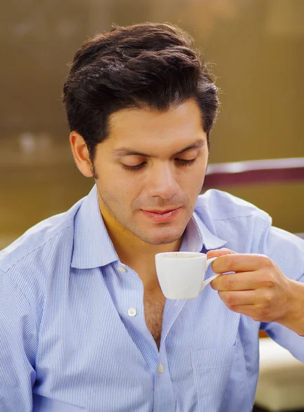 Close up of a delicious mediterranean breakfast, hot man drinking a cup of chocolate on brown background — Stock Photo, Image