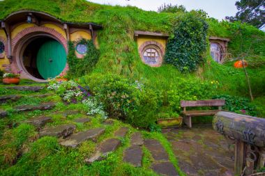 NORTH ISLAND, NEW ZEALAND- MAY 16, 2017: The front gate of Bag End, Hobbiton, the home of key character in the famous movie. Hobbiton is the fictional village created for the movie Lord of the Rings clipart