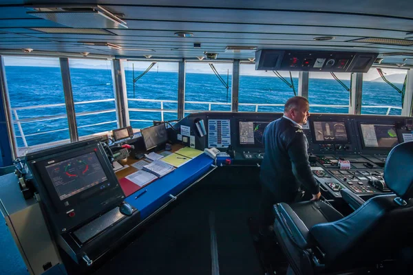 SOUTH ISLAND, NEW ZEALAND- MAY 25, 2017: Ferry boat pilot command cabin with the captain operating the machines with a beautiful view on the sea, in new zealand — Stock Photo, Image