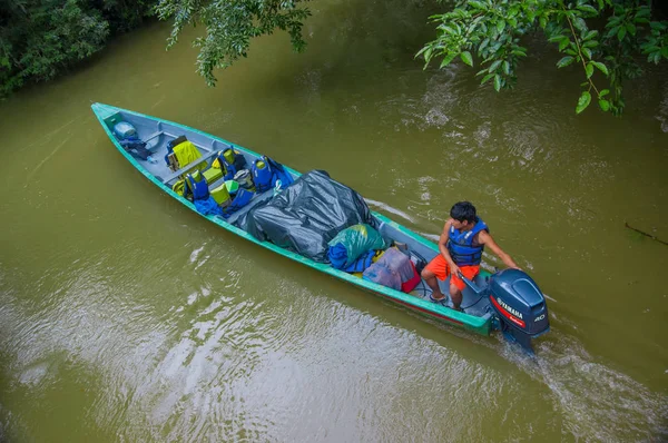 CUYABENO, ECUADOR - NOVEMBER 16, 2016: Unidentified man travelling by boat into the depth of Amazon Jungle in Cuyabeno National Park, Ecuador — Stock Photo, Image