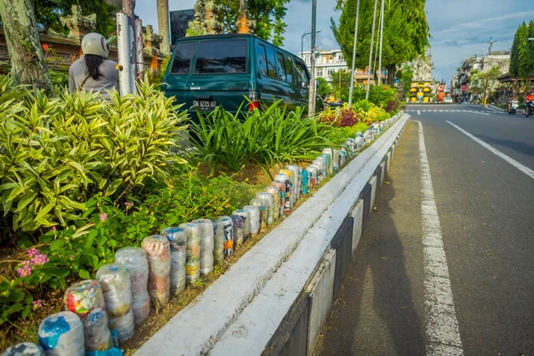 A plastic water bottles in the park at upside down in row, recycled to adorn parks and avenues, the concept of environmental protection in Denpasar Indonesia — Stock Photo, Image