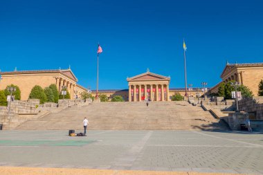 PHILADELPHIA, USA - NOVEMBER 22, 2016: Museum of Art East entrance and North wing buildings and empty main plaza with Greek revival style facade clipart