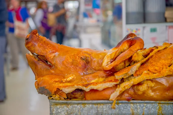 Delicious hornado roasted pork, over a silver tray, ecuadorian traditional typical andean food located in the municipal market in San Francisco in the city of Quito — Stock Photo, Image