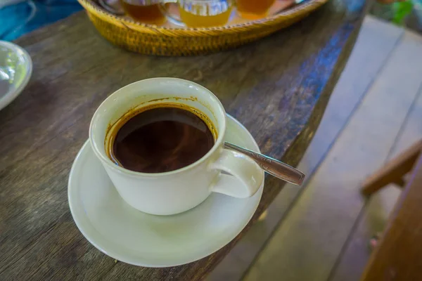 Kopi Luwak Coffee from plantation in Bali, Indonesia, on wooden background