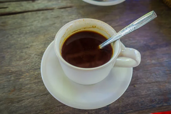 Kopi Luwak Coffee from plantation in Bali, Indonesia, on wooden background — Stock Photo, Image