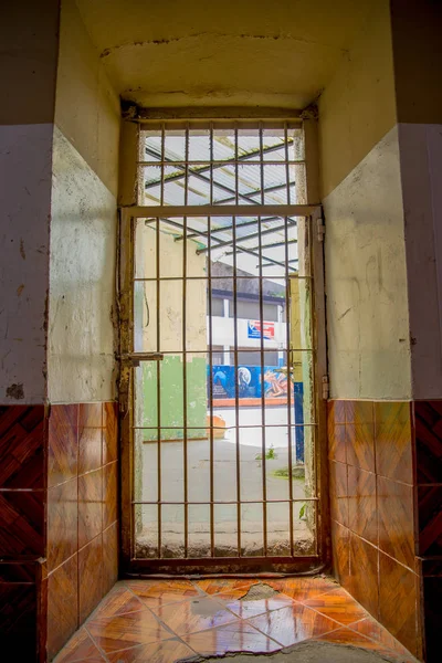 Indoor view with a door with bars, in the old prison Penal Garcia Moreno in the city of Quito — Stock Photo, Image
