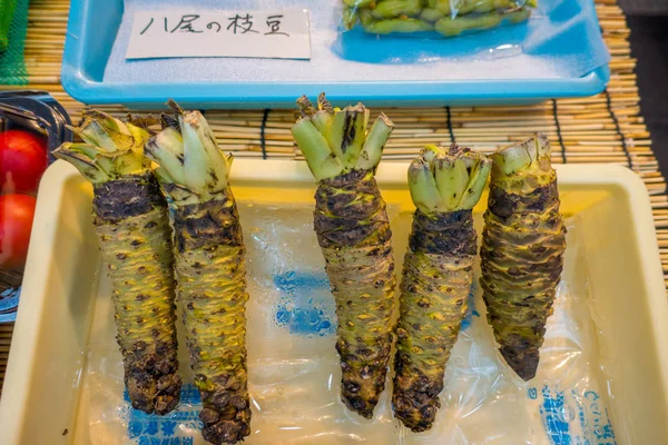 OSAKA, JAPAN - JULY 18, 2017: Fresh wasabi root are sold along the street at Kuromon Ichiba market, Nipponbashi, Osaka, Japan — Stock Photo, Image