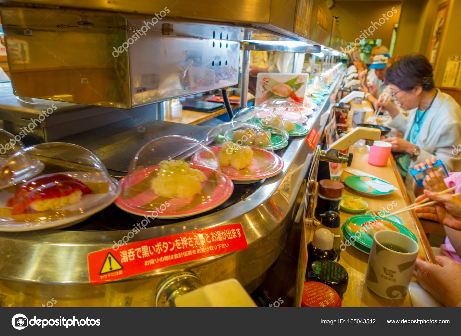 TOKYO, JAPAN -28 JUN 2017: Unidentified people eating an assorted