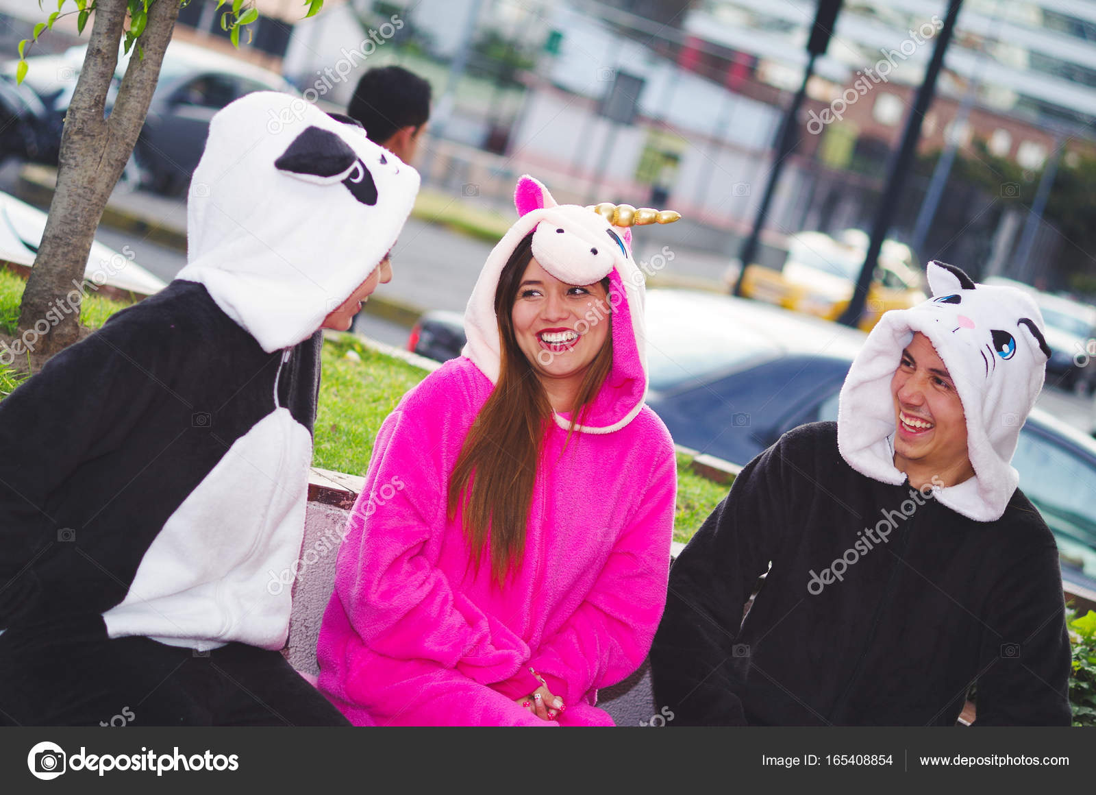 Close Up Of A Happy Group Friends Having Fun Conversation And Wearing Different Costumes One Woman Pink Unicorn Costume Other Panda Close Up Of A Happy Group Friends Having Fun Conversation And Wearing Different Costumes One Woman Pink Unicorn Costume Other Panda