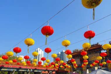 HONG KONG, CHINA - JANUARY 22, 2017: Colorful chinesse lamps hanging in the enter of Wong Tai Sin Temple, Hong Kong, China clipart