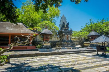 BALI, INDONESIA - MARCH 11, 2017: Uluwatu temple, in Bali, Indonesia, in a beautiful day clipart