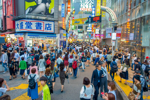 TOKYO, JAPAN JUNE 28 - 2017: Crowd of people in Shopping street near Shibuya, is one of Tokyos most colorful and busy districts, packed with shopping, dining and nightclubs