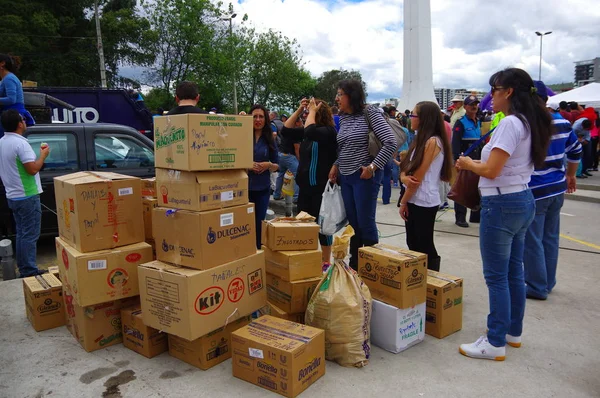 Quito, Ecuador - April,17, 2016: Unidentified citizens of Quito providing disaster relief food, clothes, medicine and water for earthquake survivors in the coast. Gathered at la Caolina Park