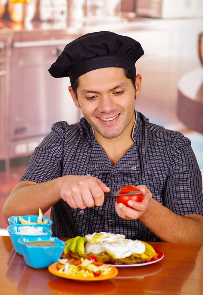 Man in kitchen cooking dish, churrasco ecuatorian cuisine — Stock Photo, Image