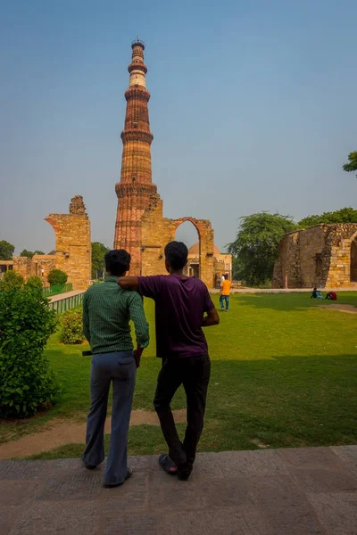 stock image DELHI, INDIA - SEPTEMBER 25 2017: Unidentified gay couple enjoying the Qutub Minar structure, one of UNESCO world heritag site, built in the early 13th century located on south of Delhi, India