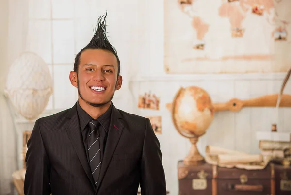 Close up of office punk worker wearing a suit with a crest in a blurred background — Stock Photo, Image