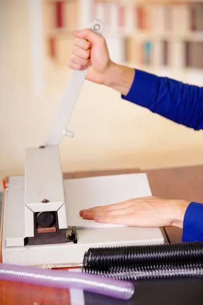 Man hands over a binder using for binding documents with plastic ring binder — Stock Photo, Image