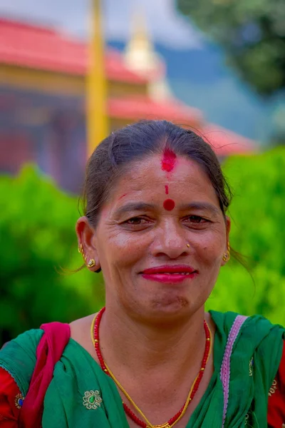 Pockhara, Nepal, September, 06 -2017: Portrait of smiling beautiful nepalese woman wearing typical cothes in a blurred background — Stock Photo, Image