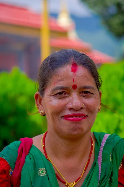 Pockhara, Nepal, September, 06 -2017: Portrait of smiling beautiful nepalese woman wearing typical cothes in a blurred background — Stock Photo, Image