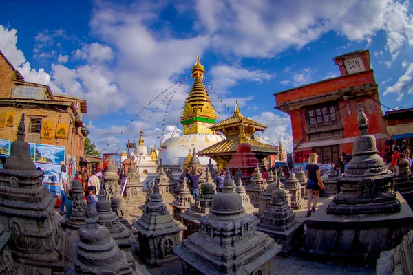 KATHMANDU, NEPAL OCTOBER 15, 2017: Unidentified people walking at outdoors of Swayambhunath, is an ancient religious complex atop a hill in the Kathmandu Valley, Nepal, fish eye effect — Stock Photo, Image
