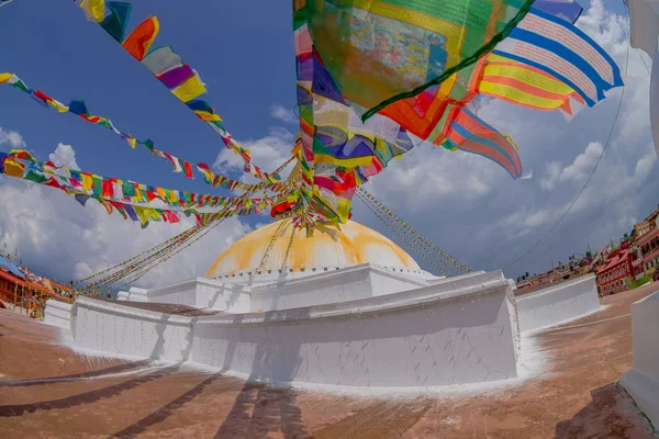 KATHMANDU, NEPAL OCTOBER 15, 2017: Unesco heritage monument Boudhanath stupa and its colorful flags in daylight with bue sky, following full restoration after 2015 earthquake damage. Kathmandu, Nepal — Stock Photo, Image