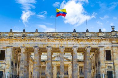 BOGOTA, COLOMBIA OCTOBER 22, 2017: Unidentified people at the enter of Colombian Capitol and Congress situated at Bolivar Square, Bogota clipart