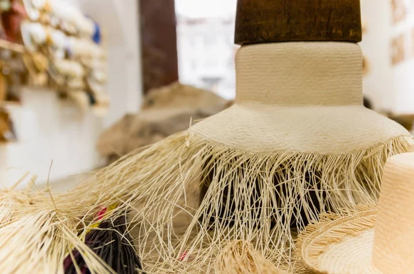 Close up of selective focus of handmade Panama Hat at indoors with a wooden structure over it, in Otavalo, Ecuador — Stock Photo, Image