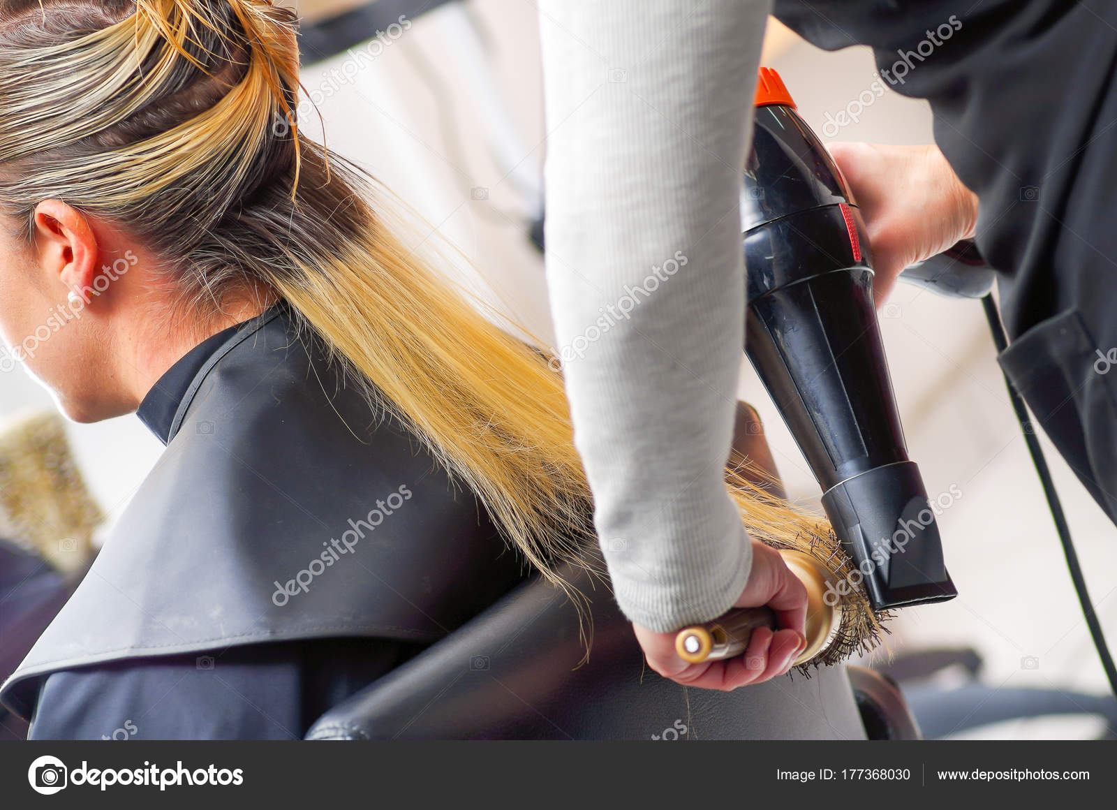 Close Up Of A Beautiful Woman In A Hair Salon And Hair Stylist