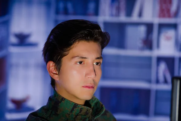 Portrait of handsome young soldier wearing a military uniform, military drone operator watching at his computer — Stock Photo, Image