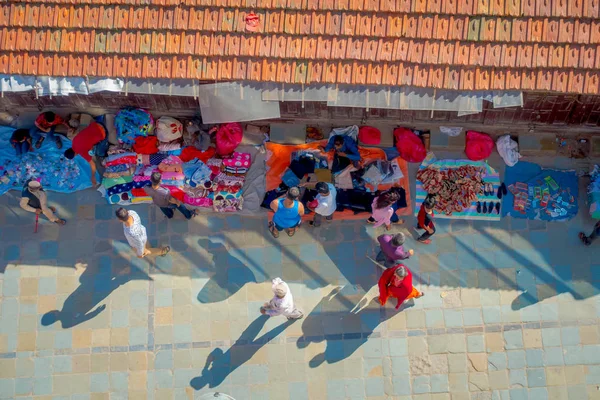KATHMANDU, NEPAL OCTOBER 15, 2017: Above view of unidentified people walking in a busy shopping street with colorful decorations in Thamel district of Kathmandu, Nepal — стоковое фото