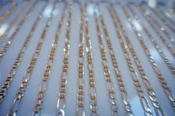 Close up of selective focus of a silver necklace inside of a souvenir store, in a small and beautiful town in Kaua, in Mexico — Stock Photo, Image
