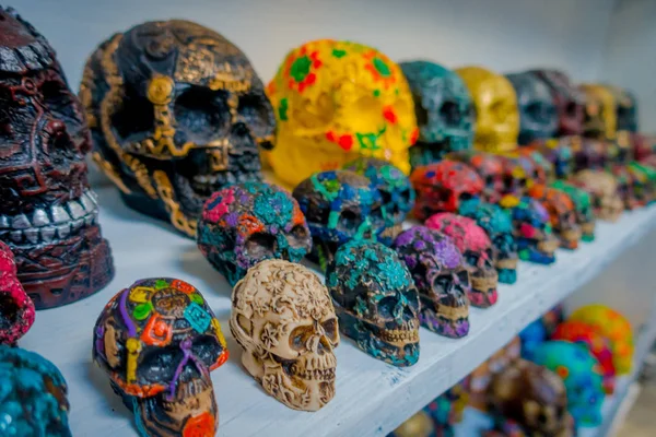 CHICHEN ITZA, MEXICO - NOVEMBER 12, 2017: Close up of beautiful and colorful Mayan ceramic skulls, a regular motif in the ancient Mayan art, sold as souvenirs in an artisans shop — Stock Photo, Image