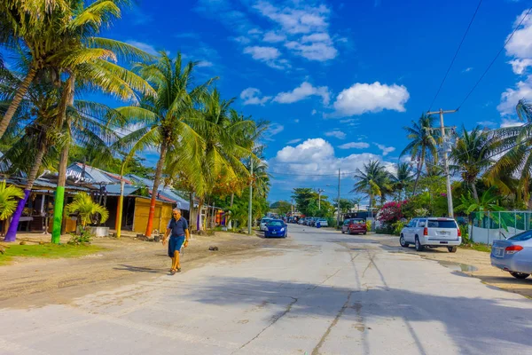 Older women and children marching through streets of Puerto Morelos carrying Mexican flag and Catholic statues, Yucatan Peninsula, Mexico, south of Cancun — Stock Photo, Image