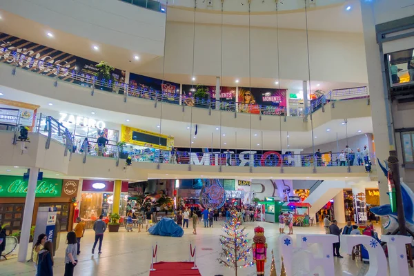 CANCUN, MEXICO - JANUARY 22, 2015: Beautiful indoor view of unidentified people walking inside of The Forum in the Cancun hotel zone is a popular place for tourists to enjoy modern shopping — Stock Photo, Image