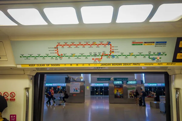 SINGAPORE, SINGAPORE - JANUARY 30, 2018: Indoor view of informative sign of train stops view from inside of Mass Rapid Transit MRT train through the city centre. Opened in 1987 the MRT — Stock Photo, Image