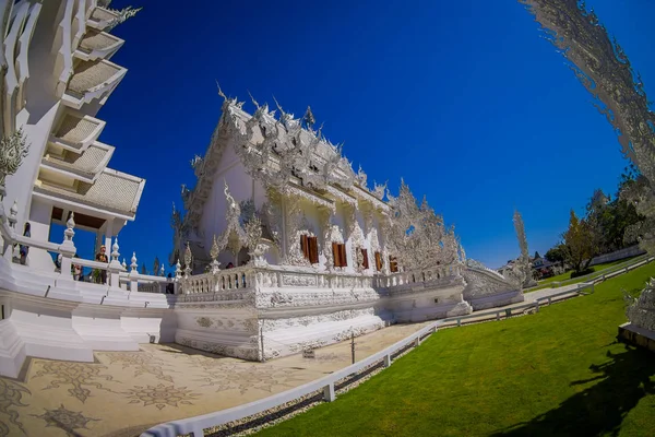 CHIANG RAI, THAILAND - FEBRUARY 01, 2018: Unidentified people walking around of beautiful ornate white temple located in Chiang Rai northern Thailand. Wat Rong Khun White Temple — Stock Photo, Image