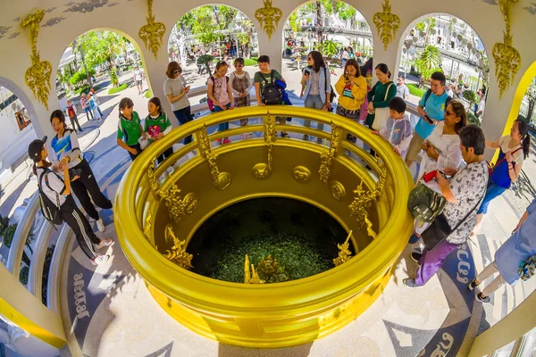 CHIANG RAI, THAILAND - FEBRUARY 01, 2018: Indoor view of unidentified people inside of a building and coin well at the White Temple in Chiang Rai, coins under water in White Temple — Stock Photo, Image