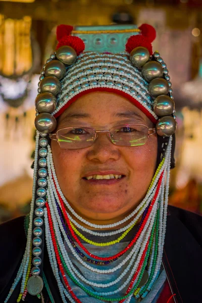 CHIANG RAI, THAILAND - FEBRUARY 01, 2018: Close up of unidentified woman wearing glasses, belongs to a Karen Long Neck hill tribe village Kayan Lahwi , Karen woman in traditional costumes — Stock Photo, Image