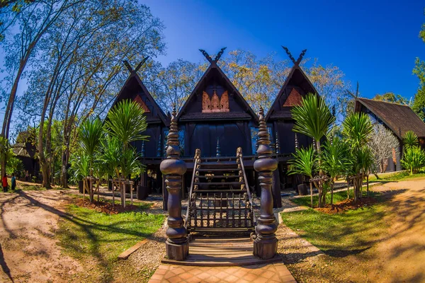 Ban Dam Kalae Kieo Fa is a vintage triplets house architecture. The black house is in Baan Dam Museum — Stock Photo, Image