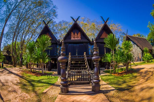 Ban Dam Kalae Kieo Fa is a vintage triplets house architecture. The black house is in Baan Dam Museum — Stock Photo, Image