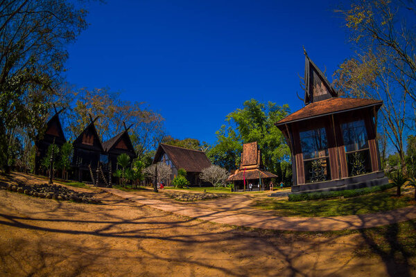 Outdoor view of many houses in Baan Dam museum, the Black House in Chiang Rai Thailand