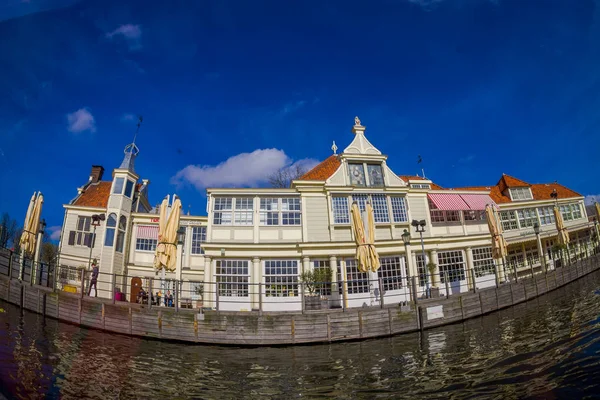 AMSTERDAM, NETHERLANDS, MARCH, 10 2018: Outdoor view of Canal cruise museum tour building bar and restaurant — Stock Photo, Image