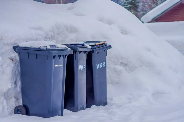 Lomen, Norway - March 26, 2018: Outdoor view of three plastic garbage collector at outdoors in Lomen, during winter at Norway — Stock Photo, Image