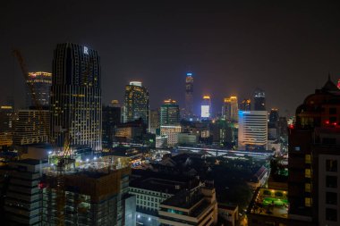 BANGKOK, THAILAND - FEBRUARY 09, 2018: Beautiful panorama view of nightlife of Bangkok city and buildings clipart