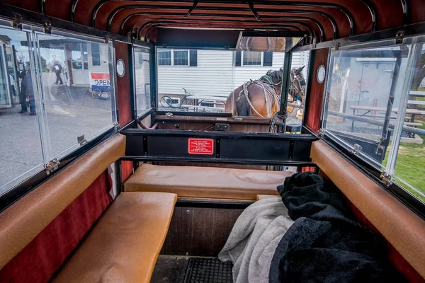 Pennsylvania, USA, APRIL, 18, 2018: Indoor view of the Amish buggy with a horse parked in a store — Stock Photo, Image