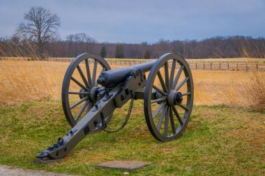 View of Napoleon, 12 lb cannon, located in a cemetery battlefield park in Gettysburg National Historical Battlefield clipart