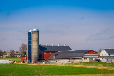 Outdoor view of huge structures located in farm barn field agriculture in Lancaster clipart