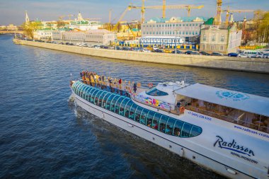 MOSCOW, RUSSIA- APRIL, 24, 2018: People on the yacht of Flotilla Radisson Royal during the river tour. Working all year round, the Flotilla carry half million passengers per year clipart