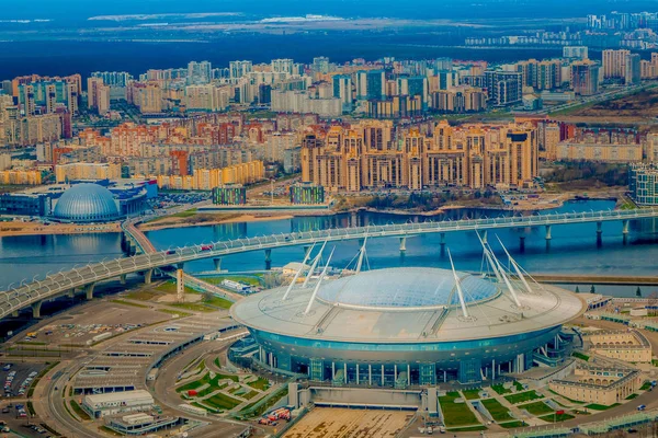 Russia, Saint-Petersburg, 29 April 2018: Aerial view of the stadium Zenit Arena, most expensively in the world, the FIFA World Cup, stadium roof in a sunny day with a city landscape in the horizont — Stock Photo, Image