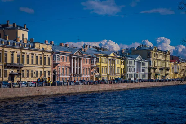 ST. PETERSBURG, RUSSIA, 01 MAY 2018: View of the Moyka River with some buildings located in the riverside in St. Petersburg was the capital of Russia and attracts many tourists — Stock Photo, Image